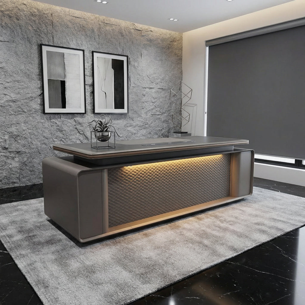 Monolite Executive Desk in matte grey with illuminated geometric front panel, positioned in a modern stone wall office — luxury high end workspace furniture by DreamSpace Collection Ontario.