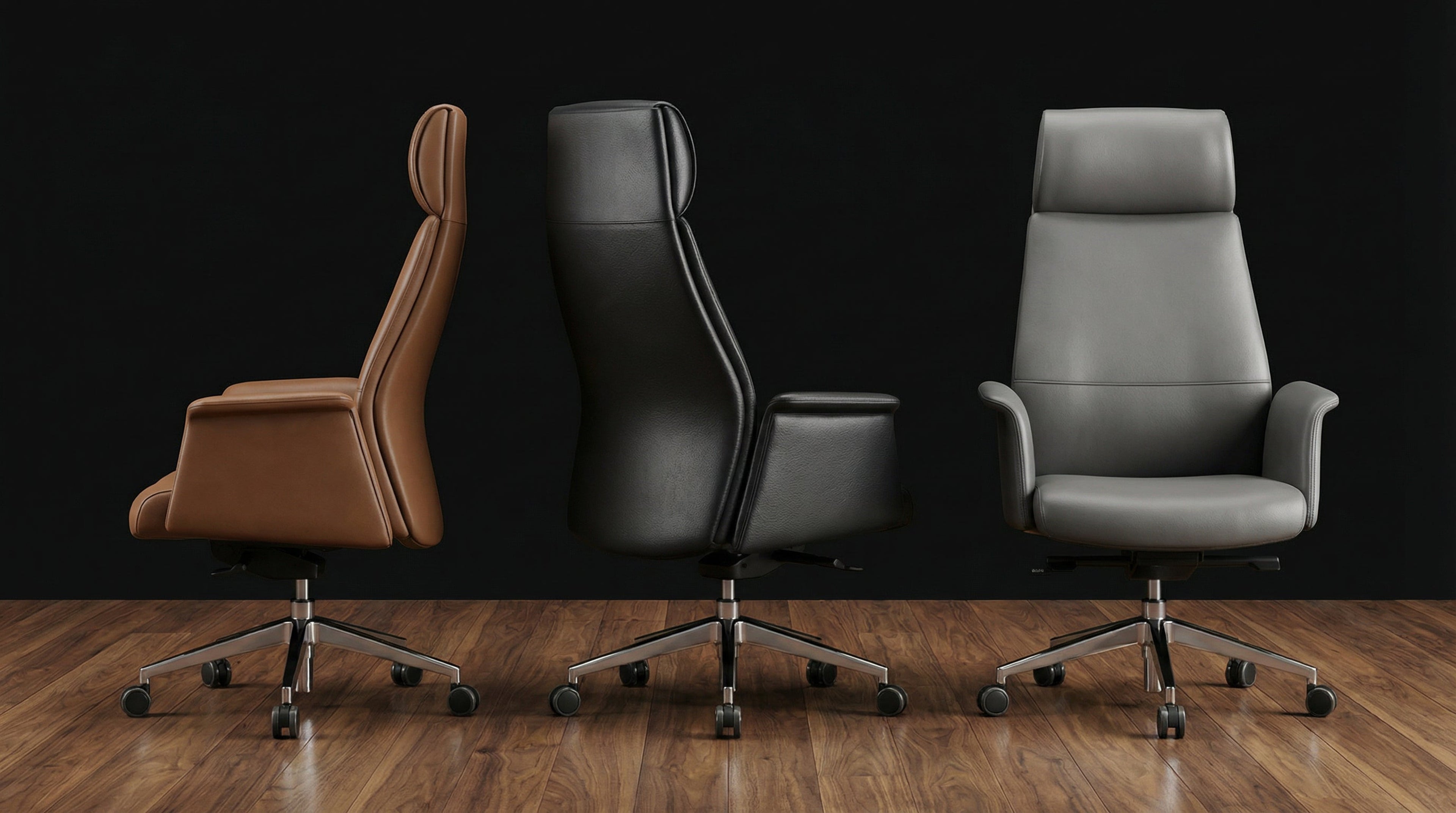 Three luxury executive office chairs in brown, black and grey leather placed on hardwood flooring, premium ergonomic seating for high end workspaces by DreamSpace Collection Ontario.