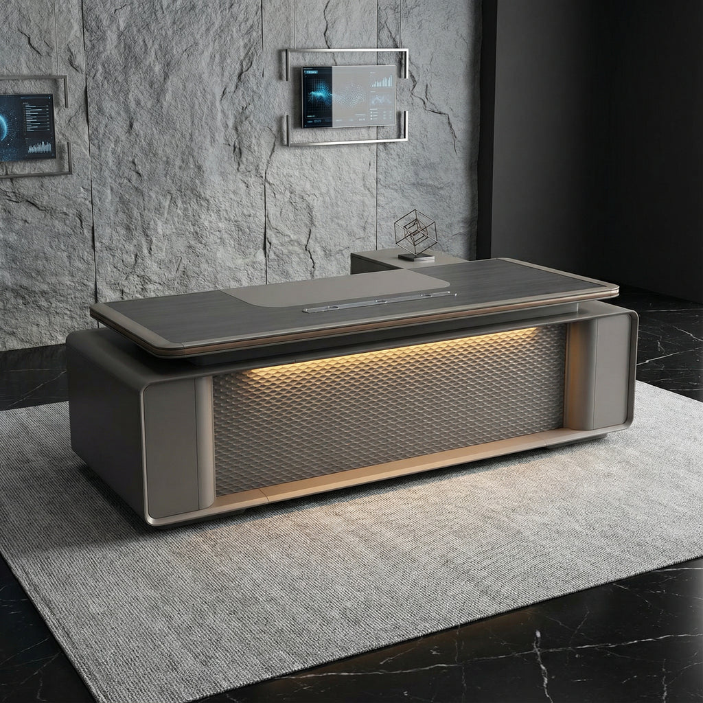 Monolite L-shaped executive desk in matte grey with illuminated geometric front panel and built-in side storage, styled in a modern stone wall office — luxury high end workspace furniture by DreamSpace Collection Ontario.