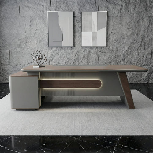 Aurelia L-shaped executive desk with modern sloped design, walnut top and illuminated panel detailing, featuring built-in storage and wireless charging — luxury high end office desk by DreamSpace Collection Ontario.
